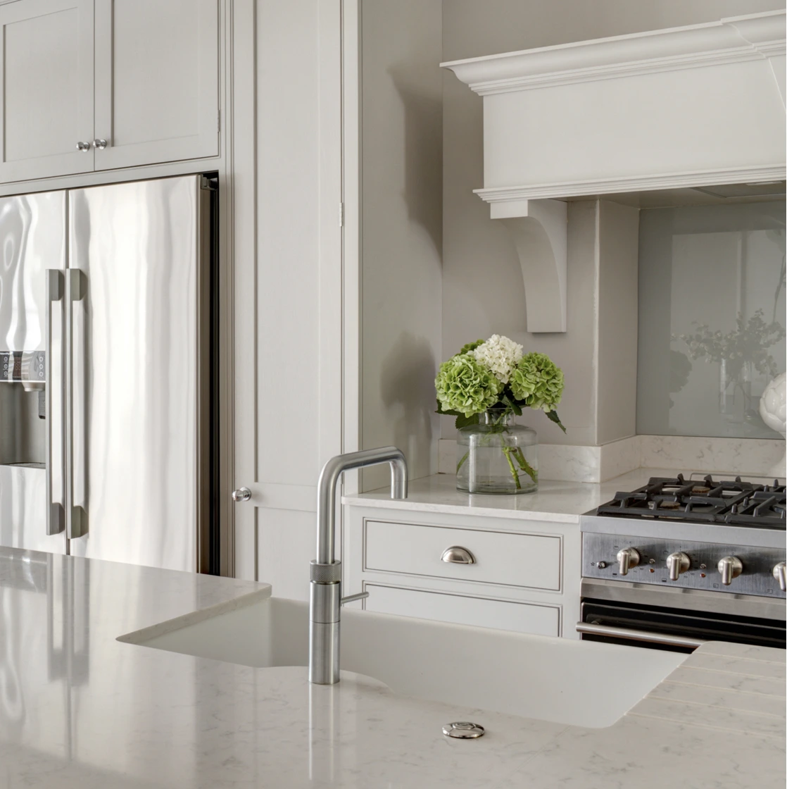Traditional kitchen with pale cabinetry, stone worktop and range cooker