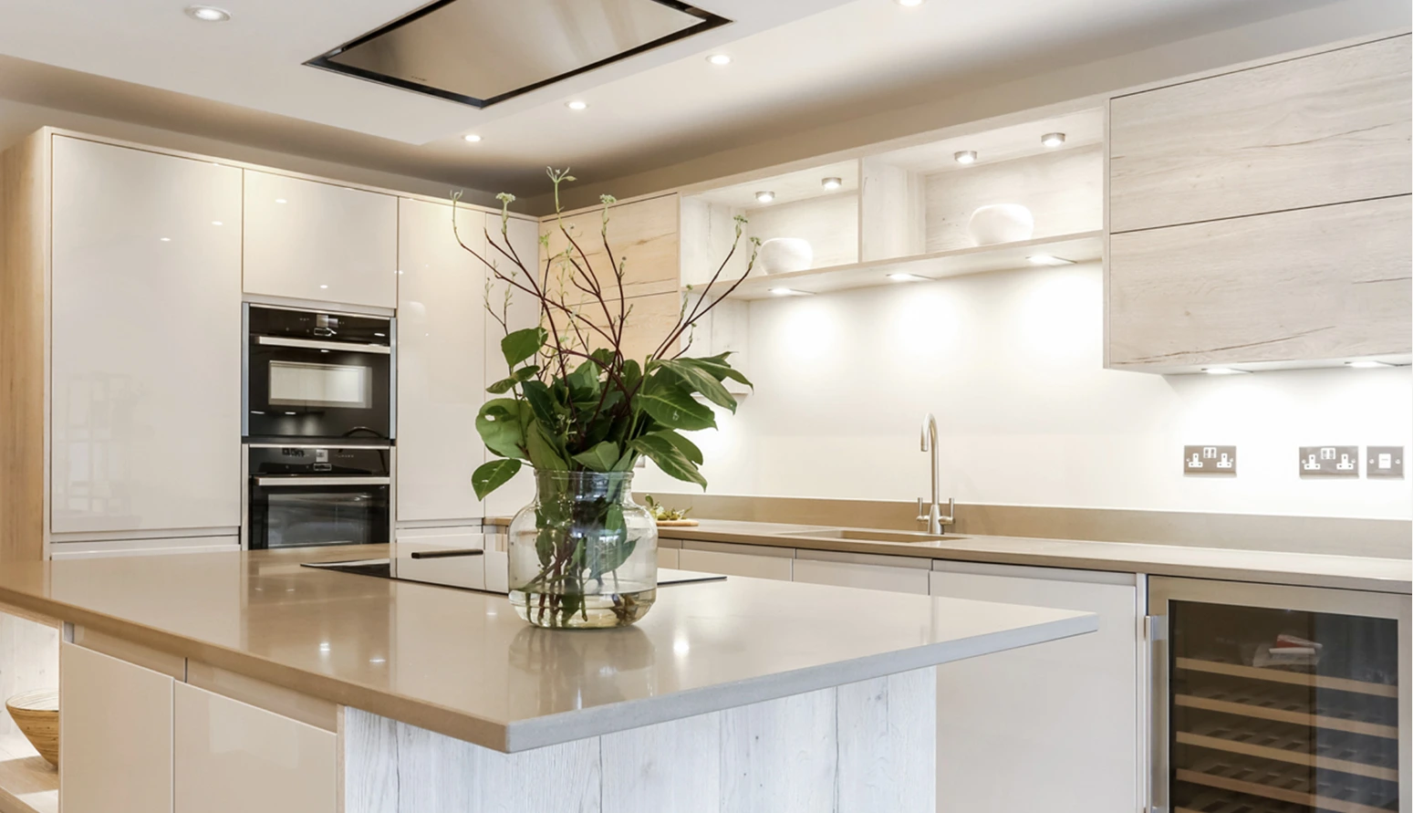 White house gardens kitchen with a central island and light wood cabinetry